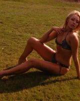 Blonde beauty is by the lake in sexty bikini