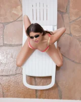 Latin baby resting in sexy bikini and black sunglasses