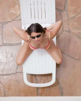 Latin baby resting in sexy bikini and black sunglasses