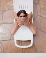 Latin baby resting in sexy bikini and black sunglasses