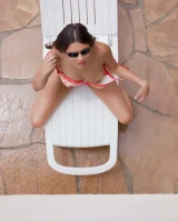 Latin baby resting in sexy bikini and black sunglasses