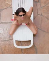Latin baby resting in sexy bikini and black sunglasses