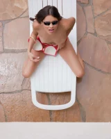 Latin baby resting in sexy bikini and black sunglasses