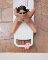 Latin baby resting in sexy bikini and black sunglasses