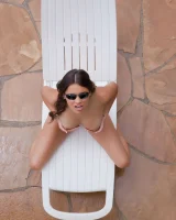 Latin baby resting in sexy bikini and black sunglasses