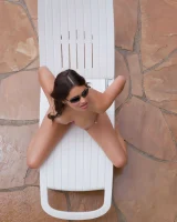 Latin baby resting in sexy bikini and black sunglasses