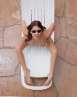 Latin baby resting in sexy bikini and black sunglasses