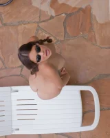 Latin baby resting in sexy bikini and black sunglasses