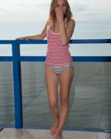 Slim body puffy nipples chick in sexy stripped bikini