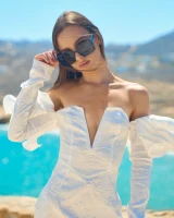 Passionate brunette in white micro bikini has puffy nipples