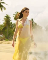 Exciting nude beach busty girl in yellow bikini