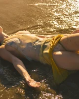 Exciting nude beach busty girl in yellow bikini