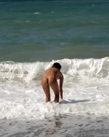 Wonderful sexy busty latin baby is on the beach in exciting micro bikini showing her tasty apple ass in micro