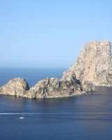 Micro bikini beauty strips at the rocks by the sea