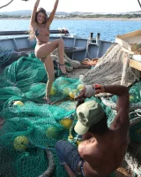 Topless micro bikini hottie is in the harbor and in the ship